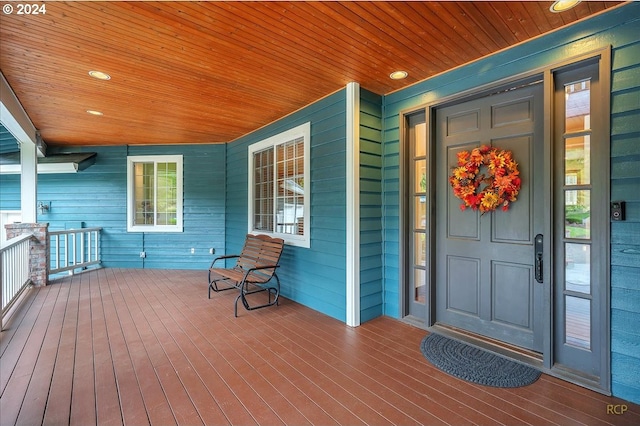 entrance to property featuring a porch