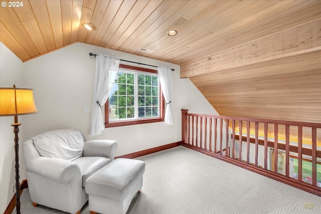 sitting room with carpet flooring, wooden ceiling, and vaulted ceiling