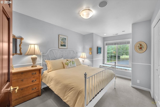 carpeted bedroom featuring a closet