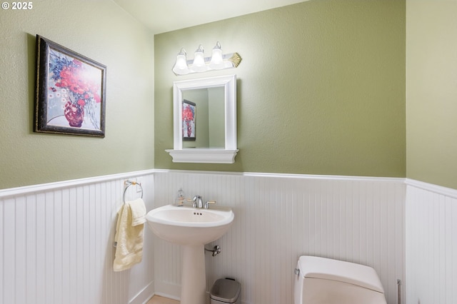 bathroom featuring sink and toilet