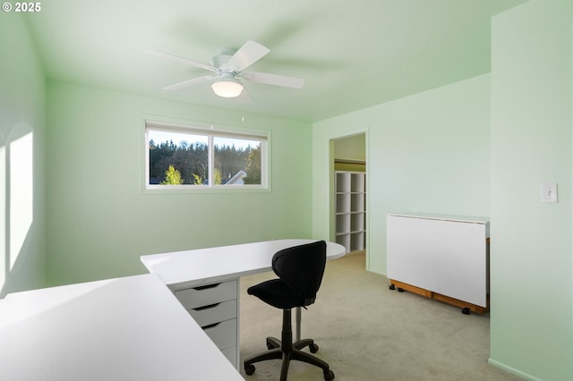 office with light carpet and ceiling fan