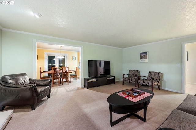 carpeted living room with a textured ceiling and ornamental molding