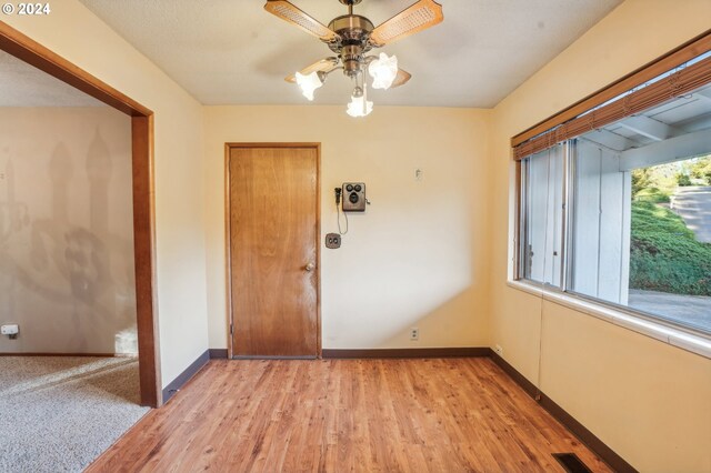 entryway featuring ceiling fan and light hardwood / wood-style floors