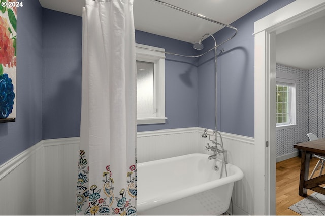 bathroom with shower / bath combination with curtain and hardwood / wood-style floors