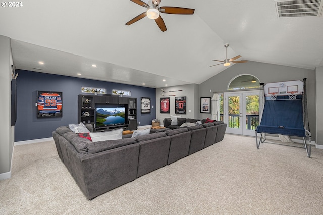 carpeted living room with vaulted ceiling and french doors