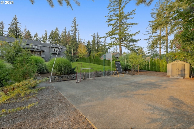 view of patio with a storage shed