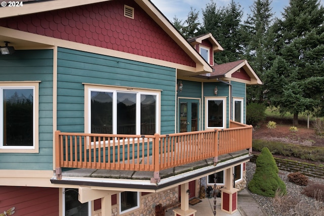 rear view of property with a balcony