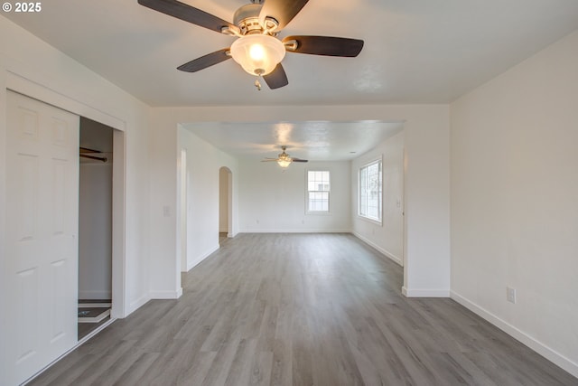 interior space featuring ceiling fan, light hardwood / wood-style floors, and a closet