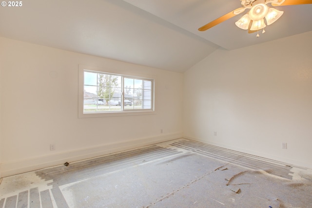 spare room featuring ceiling fan and vaulted ceiling