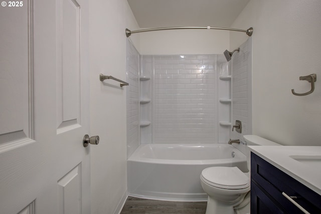 full bathroom with washtub / shower combination, toilet, vanity, and wood-type flooring