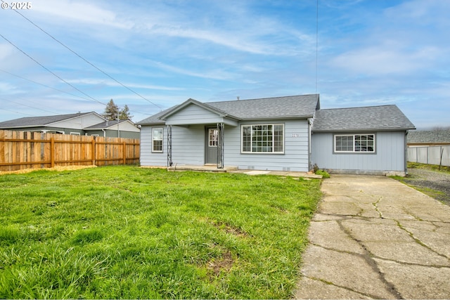 ranch-style home featuring a front yard