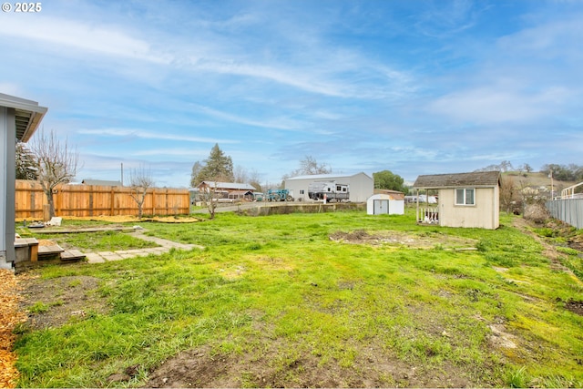 view of yard with a storage unit