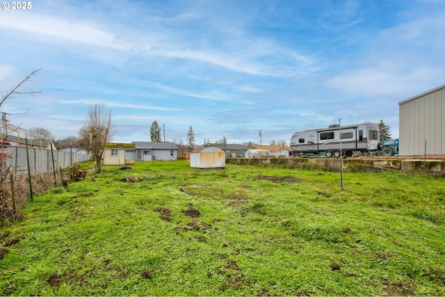 view of yard with a storage unit