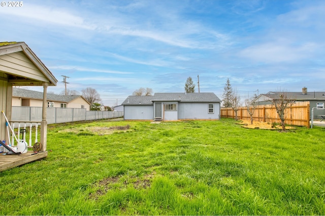 back of property featuring a lawn