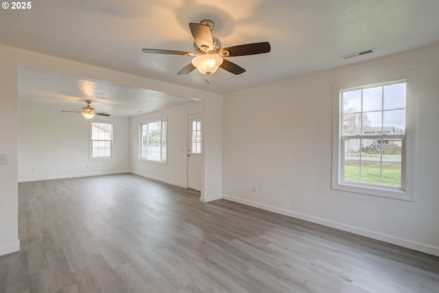 interior space with hardwood / wood-style flooring and ceiling fan