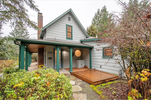 back of property featuring a porch