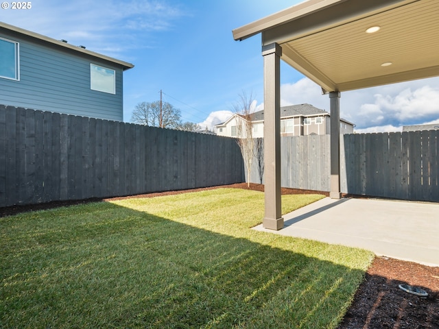 view of yard with a patio area and a fenced backyard