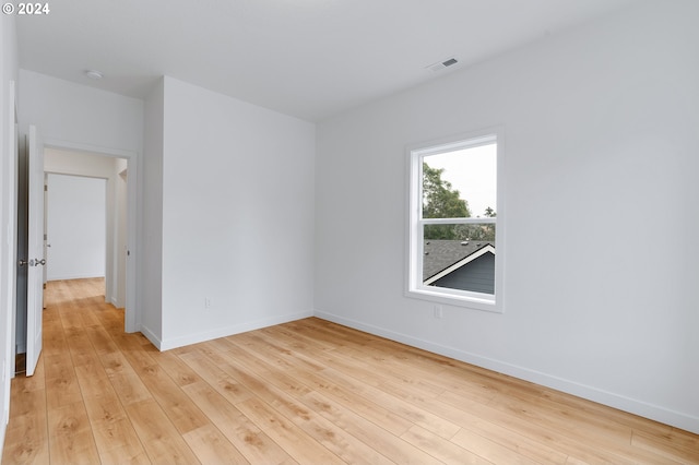 spare room with light hardwood / wood-style floors