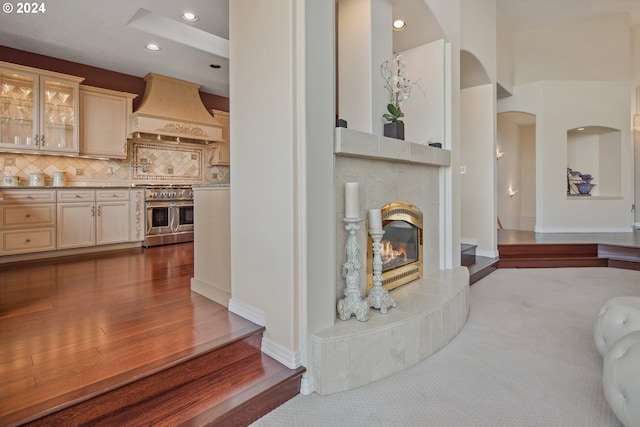 living room featuring a tiled fireplace