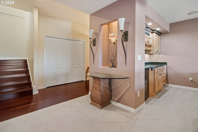 bathroom featuring a shower with door and vanity