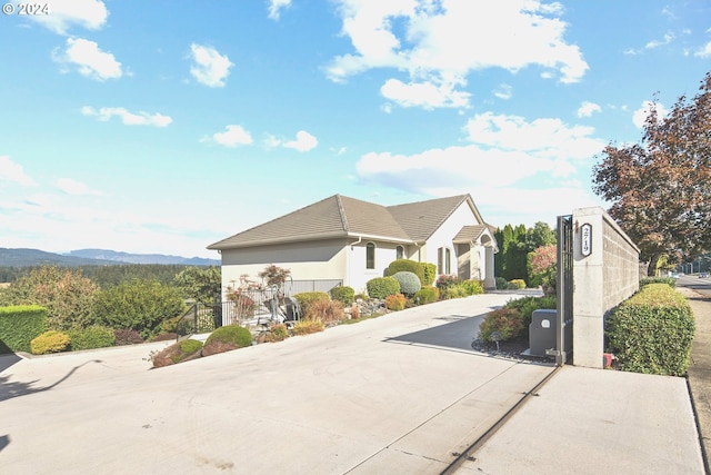 view of front of property with a mountain view