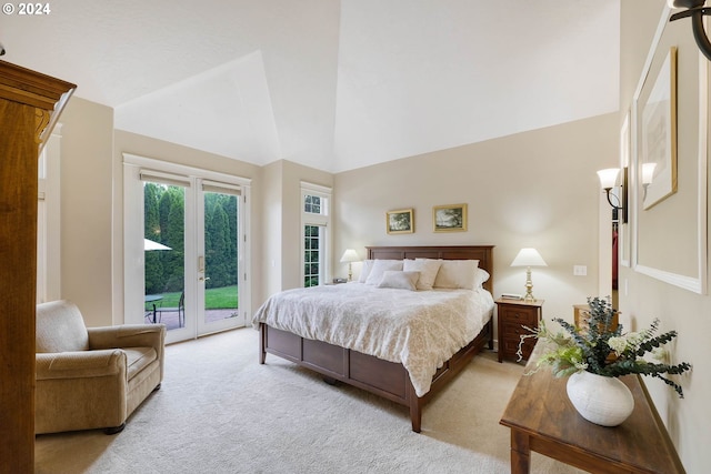 bedroom featuring light carpet, access to outside, and high vaulted ceiling