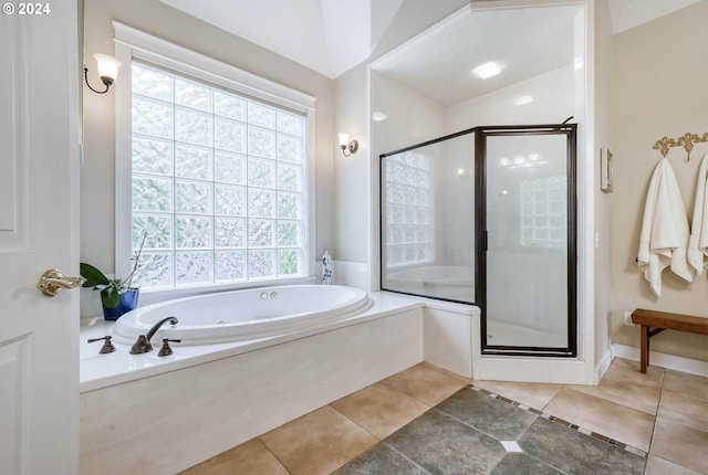 bathroom with separate shower and tub, tile patterned floors, and lofted ceiling