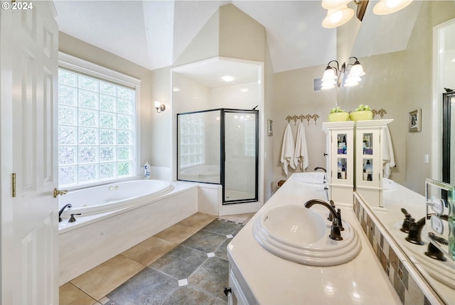 bathroom with plus walk in shower, an inviting chandelier, tile patterned floors, lofted ceiling, and vanity