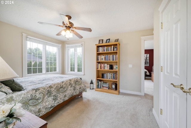 carpeted bedroom featuring ceiling fan