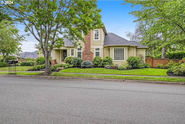 view of front of home with a front lawn