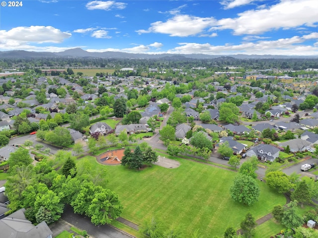 birds eye view of property with a mountain view