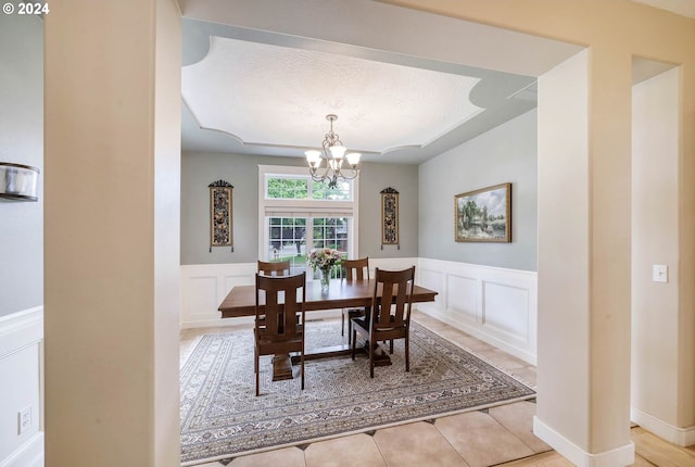 dining space with an inviting chandelier