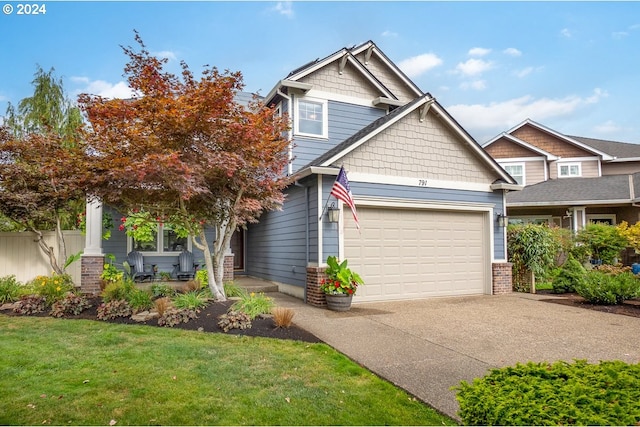 craftsman-style home with a front lawn and a garage