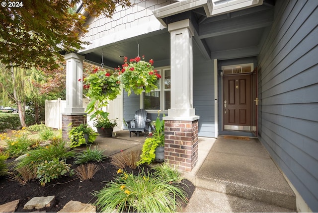 doorway to property with a porch