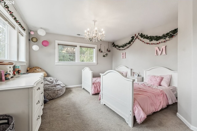 bedroom with carpet and a notable chandelier