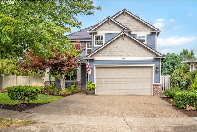 craftsman house with a garage