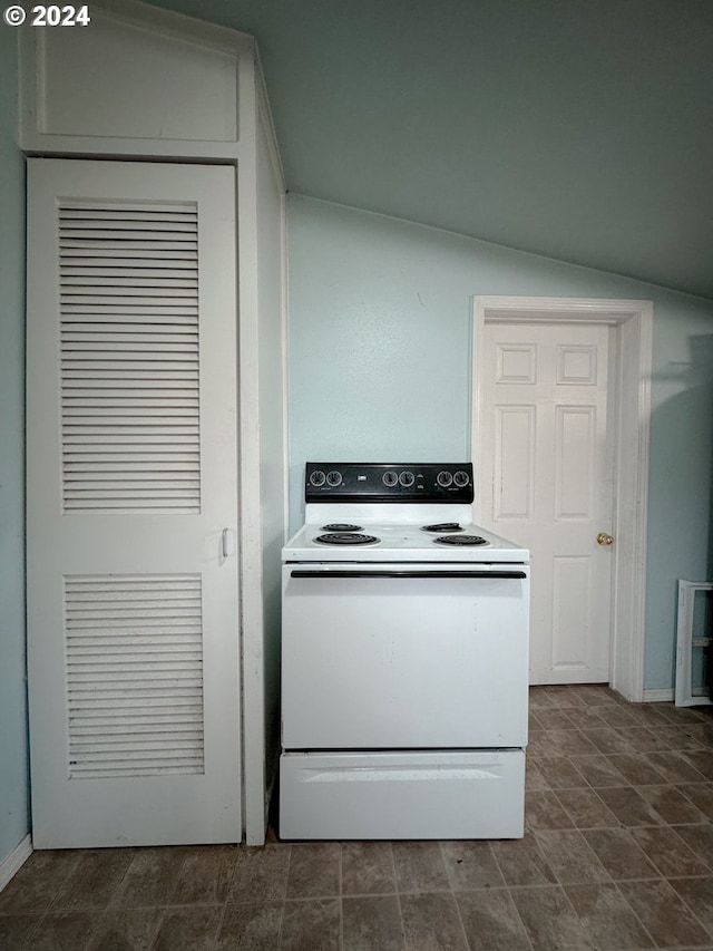 kitchen with white electric range oven and vaulted ceiling