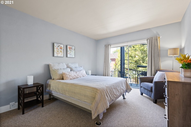 carpeted bedroom featuring access to exterior