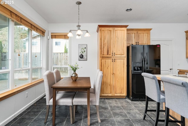 dining room featuring recessed lighting, baseboards, a wealth of natural light, and a chandelier