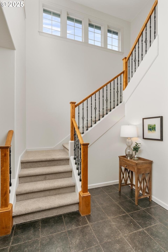 stairway featuring baseboards