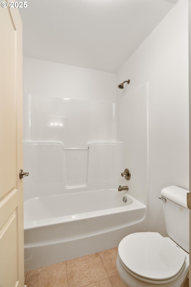 bathroom featuring toilet and shower / bath combination