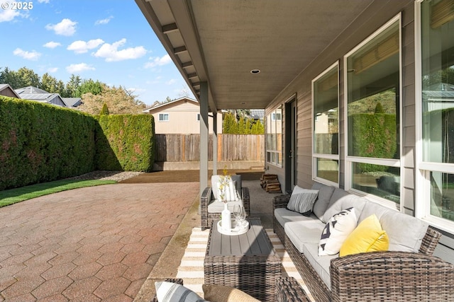 view of patio with outdoor lounge area and a fenced backyard