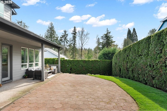 view of patio / terrace featuring outdoor lounge area and a fenced backyard