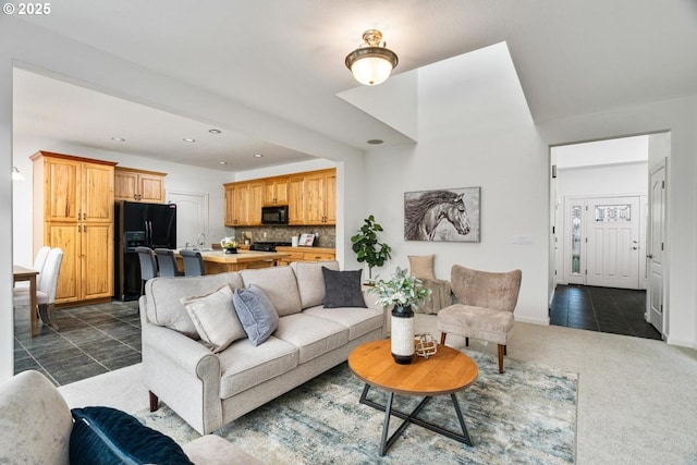 living room with dark tile patterned flooring, recessed lighting, baseboards, and dark carpet