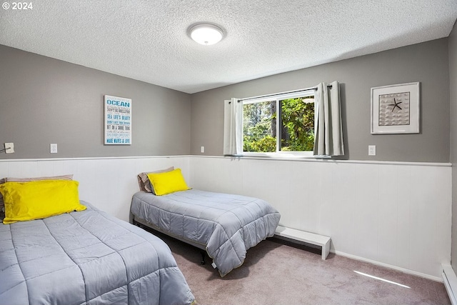 carpeted bedroom with a textured ceiling