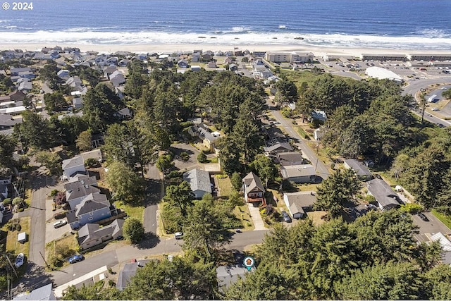 aerial view featuring a view of the beach and a water view