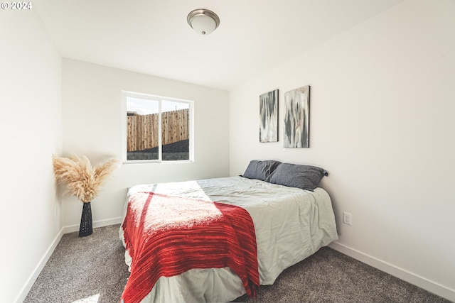 bedroom with dark carpet