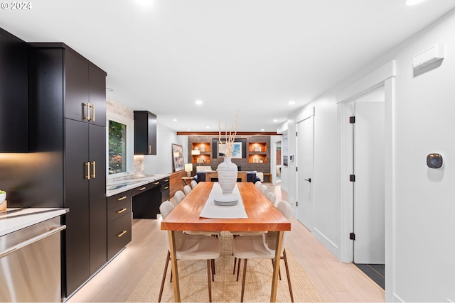 kitchen featuring dishwasher and light hardwood / wood-style flooring