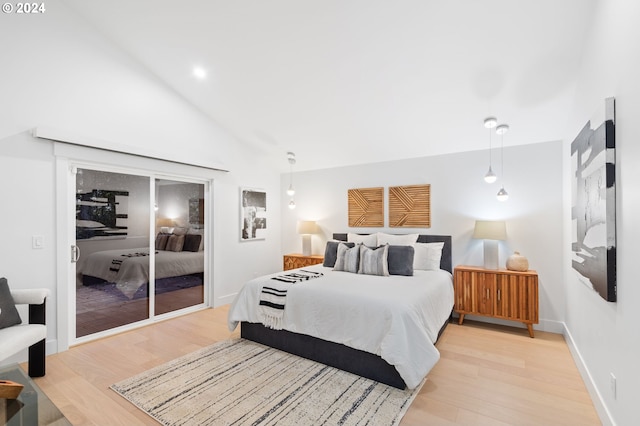 bedroom featuring high vaulted ceiling and light wood-type flooring