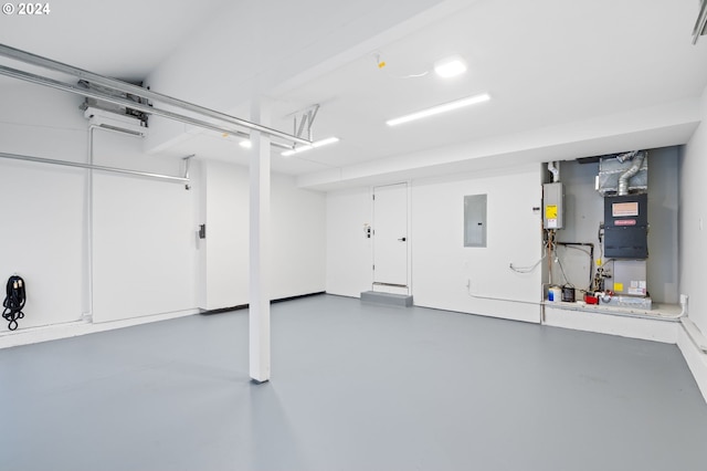 garage with electric panel and heating unit